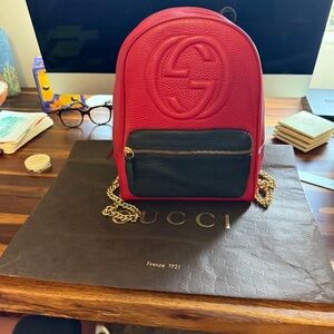 Gucci Red Leather Mini Backpack with Black Front Pocket and Gold Chain
